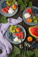 Healthy food. Healthy snack. Watermelon, grapes blueberries and cottage cheese