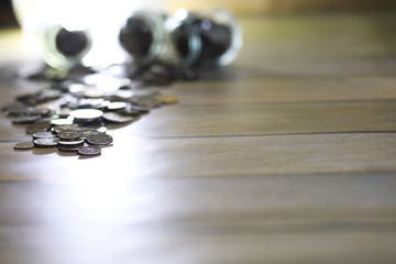 Accumulated coins stacked in glass jars