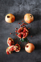 Ripe grains of pomegranate on the table. Pomegranate juice.