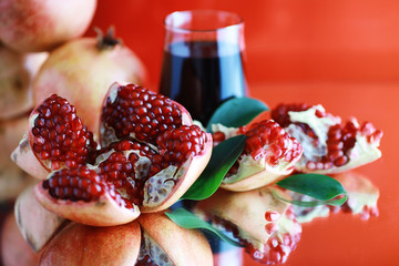 Ripe grains of pomegranate on the table. Pomegranate juice.