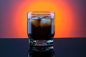 coca cola in a glass with ice