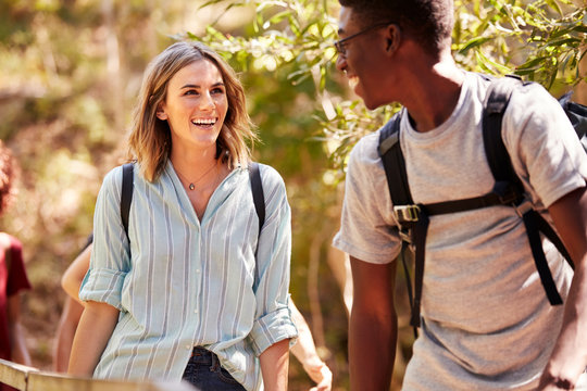 Happy Mixed Race Millennial Couple Hiking In A Forest Together, Waist Up, Close Up