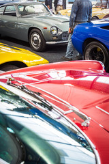 Old cars auction - People viewing cars on sale during an expensive old cars  auction
