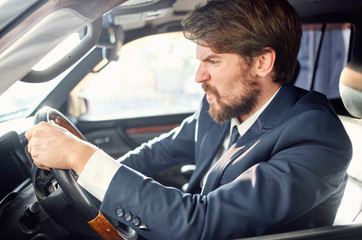 young man driving a car