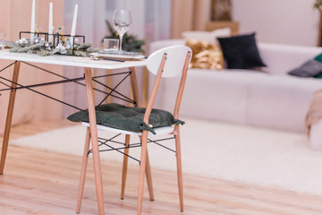 Table setting in the New Year's style. Simple and stylish interior rooms in the New Year's style