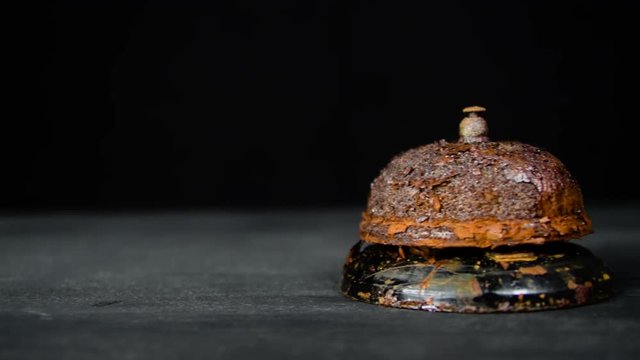 Hotel service style rusty call bell. Rusted rotten reception old vintage artifact. 