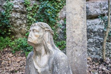 Fototapeta na wymiar sculpture of jesus on the cross made in stone in the monastery of Montserrat in Barcelona, Spain