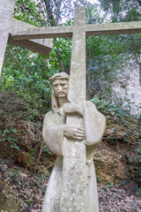 Catholic, sculpture of jesus on the cross made in stone in the monastery of Montserrat in Barcelona, Spain