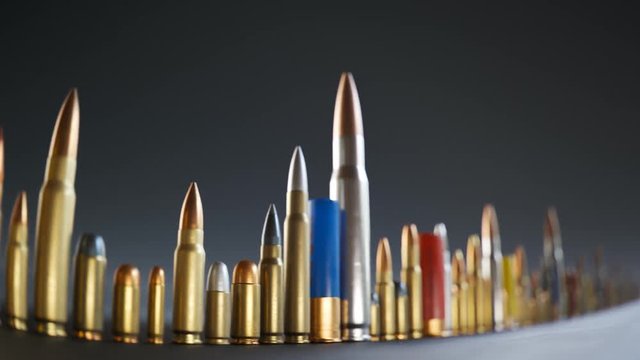 An endless row of different ammunition types standing on the ground in a loop.