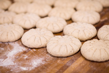 Fototapeta na wymiar balls of dough bread getting ready to be baked