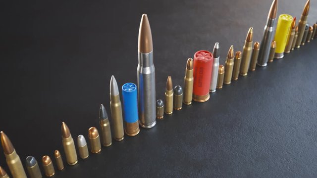 An endless row of different ammunition types standing on the ground in a loop.