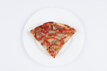 A delicious homemade pizza on a plate isolated on a white background. Pizza on a plate with a knife and a fork