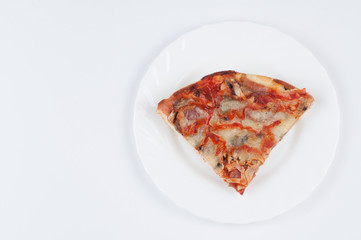 A delicious homemade pizza on a plate isolated on a white background. Pizza on a plate with a knife and a fork