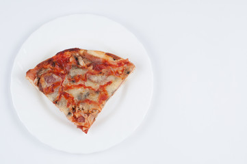 A delicious homemade pizza on a plate isolated on a white background. Pizza on a plate with a knife and a fork