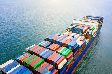 the large TEU container ship sailing in the sea carriage the shipment cargo from loading port to...