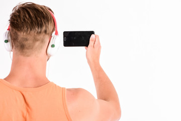 online communication. new technology in modern life. sexy muscular man listen music. man listen new...