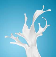 milk or white liquid splash on blue background.