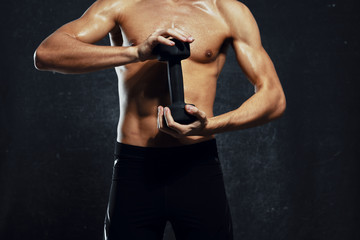 Fototapeta na wymiar young man lifting weights