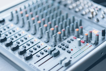 Sound recording studio. Electronic device for combining sounds. Closeup of professional audio mixer.