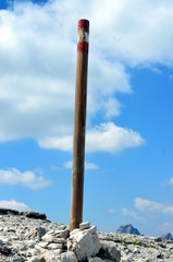 White and red paint to indicate the mountain path in Dolomites protected by UNESCO Italy