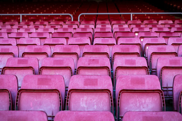 Obraz premium Vacant red chairs of stadium stand