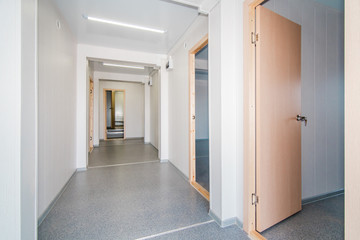 Light white empty office room with bright lighting