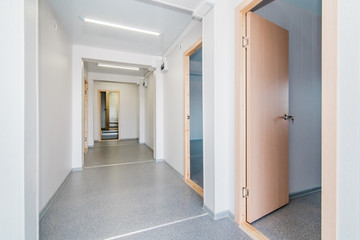 Light white empty office room with bright lighting