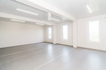 Light white empty office room with bright lighting