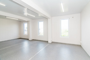 Light white empty office room with bright lighting