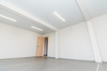 Light white empty office room with bright lighting