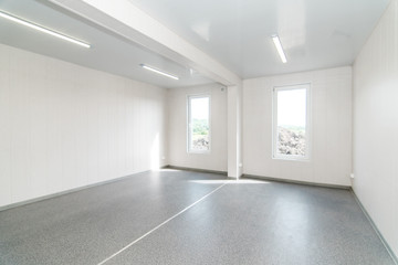 Light white empty office room with bright lighting