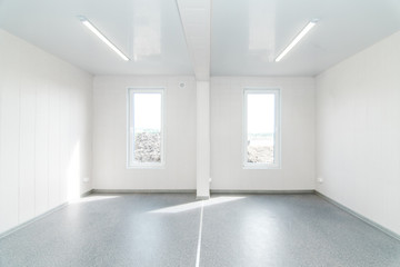 Fototapeta na wymiar Light white empty office room with bright lighting