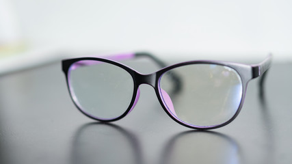 Clear glasses placed on a blurred background
