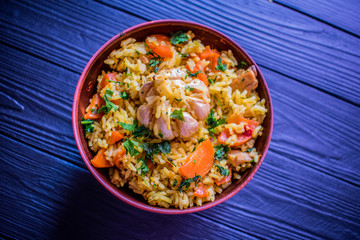 pilaf with meat on a wooden table