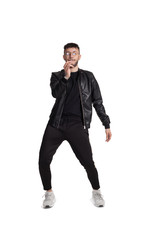 Full-length photo of a funny guy dancing in studio isolated on white background.