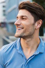 Fototapeta premium Handsome young man dressed casually spending time outdoors