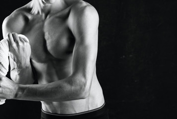 Fototapeta na wymiar muscular man posing on black background