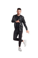 Full-length photo of a funny guy dancing in studio isolated on white background.