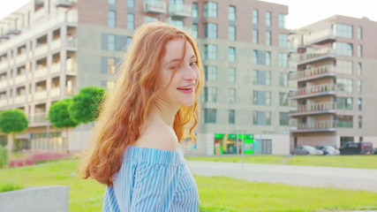 Red-haired lady. Walking Medium shot