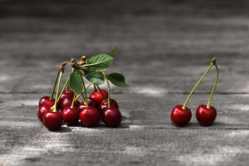 Dark red cherries. Cherries on vintage wooden surface. Juicy berries from the garden