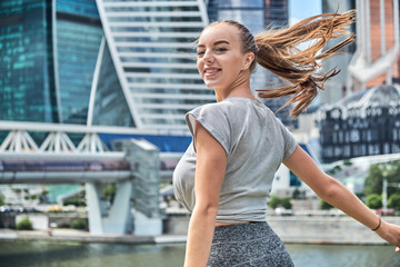 young hipster woman walking through the city streets. fun day free from experiences. happiness from simple things