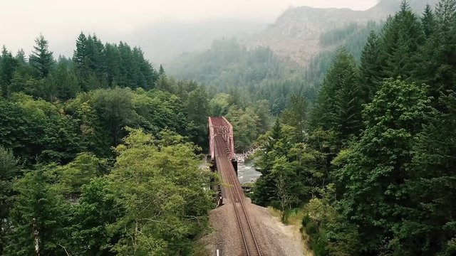 Foggy mountain railroad bridge drone landscape views