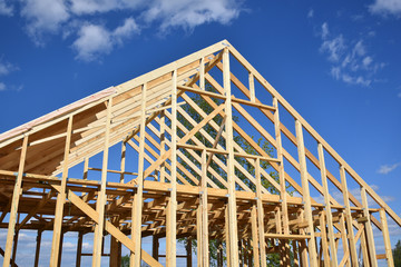Wood frame residential building under construction.Building construction, wood framing structure at...