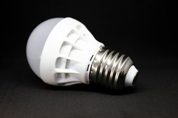 LED lamp on dark background. LED bulb on black background.