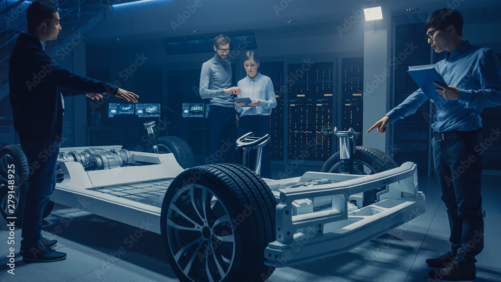Leinwandbilder automobile design engineers working on electric car platform chassis prototype, using cad software f