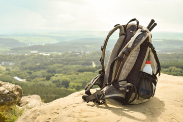 Fototapeta na wymiar Hipster hiker tourist backpack on background nature in mountain, blurred panoramic landscape, traveler relax holiday concept, view planning wayroad in trip vacation, travel adventure.