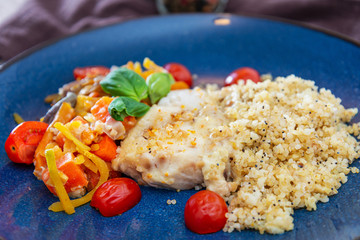 cod fish with vegetables, small vegetables and marine sauce