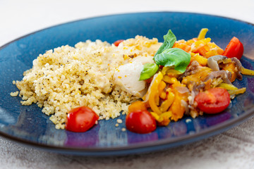 cod fish with vegetables, small vegetables and marine sauce