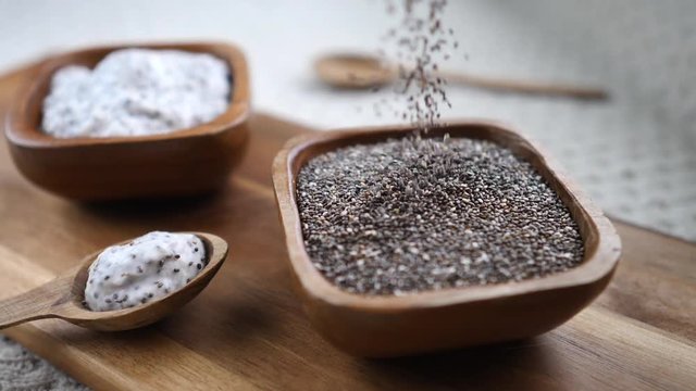 Healthy Chia Seeds In Wooden Bowl On Table Close-Up.