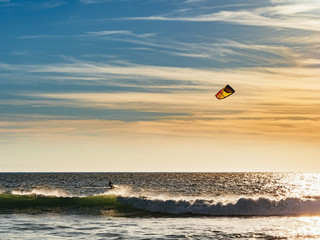Kite surfer surfing at sunset at Tarifa beach